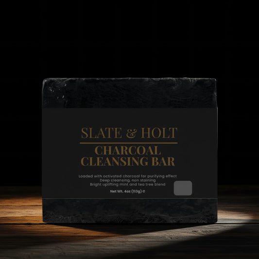 Black soap bar with 'Slate & Holt' branding on a dark background