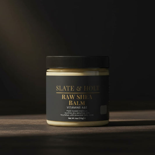Jar of Slate & Holt Raw Shea Balm on a dark background