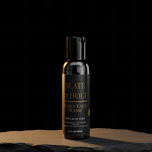 Bottle of Slate & Holt Daily Face Wash on a dark background