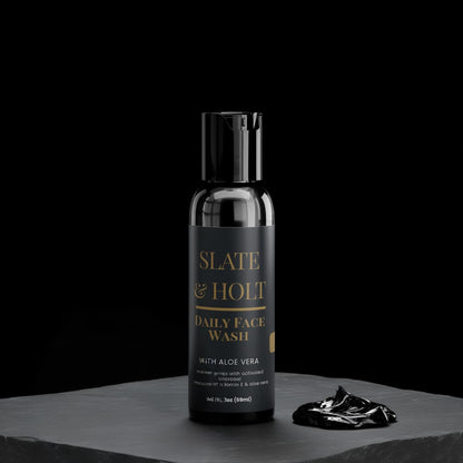 Slate & Holt daily face wash bottle with a black background