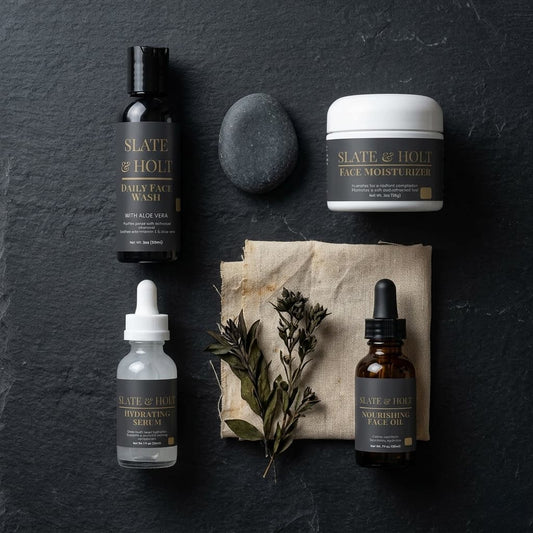 Skincare products from Slate & Holt on a dark surface with natural elements.